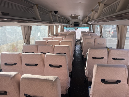 Um ônibus King Long amarelo usado, com motor Yuchai de 63 lugares e transmissão manual